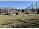 Lovely home with brick and siding surrounded by lush greenery and a detached garage at 3040 Old Morgantown Rd, Martinsville, IN 46151