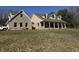 Expansive two-story home featuring a brick facade, inviting front porch, and well-manicured lawn at 3040 Old Morgantown Rd, Martinsville, IN 46151