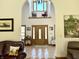 Grand foyer featuring tile flooring, high ceilings, and large windows, creating a bright, welcoming entrance at 3040 Old Morgantown Rd, Martinsville, IN 46151