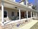 Inviting front porch with ample seating, supported by columns and featuring brick accents at 3040 Old Morgantown Rd, Martinsville, IN 46151