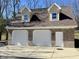 Three-car garage featuring two gabled dormers and brick facade at 3040 Old Morgantown Rd, Martinsville, IN 46151