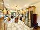 Spacious kitchen featuring custom cabinetry, granite countertops, stainless steel appliances, and tile floors at 3040 Old Morgantown Rd, Martinsville, IN 46151