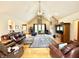 Spacious living room with hardwood floors, a brick fireplace, and comfortable seating at 3040 Old Morgantown Rd, Martinsville, IN 46151