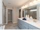 Elegant bathroom featuring double vanity, tiled floor, and a walk-in shower at 3547 Planck Cir, Danville, IN 46122