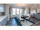 Elegant dining room with large windows, stylish lighting, and seating for eight at 3547 Planck Cir, Danville, IN 46122