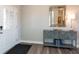 Welcoming foyer with hardwood floors, decorative mirror, stylish cabinet and soft lamp lighting at 3547 Planck Cir, Danville, IN 46122