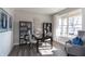 Bright home office featuring built-in shelving, a desk, and a comfortable accent chair at 3547 Planck Cir, Danville, IN 46122