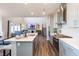 Spacious, modern kitchen with a large island, stainless steel appliances, and open layout to the living room at 3547 Planck Cir, Danville, IN 46122