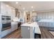 Modern kitchen featuring stainless steel appliances, light gray cabinets, and island with seating at 3547 Planck Cir, Danville, IN 46122