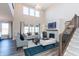 Spacious living room filled with natural light, showcasing modern furnishings and a cozy fireplace at 3547 Planck Cir, Danville, IN 46122