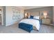 Beautifully decorated main bedroom with large headboard and blue accent pillows at 3547 Planck Cir, Danville, IN 46122