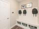 Well-organized mudroom with bench seating, storage cubbies, and coat hooks at 3547 Planck Cir, Danville, IN 46122