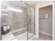 Modern bathroom showcasing a tiled shower with a glass door and built-in bench at 3547 Planck Cir, Danville, IN 46122