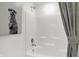 Clean and bright bathroom with tub/shower, shower curtain and decorative wall art at 3548 Planck Cir, Danville, IN 46122