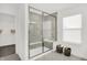 Modern bathroom featuring a spacious glass-enclosed shower, marble surround, and ample bench seating at 3548 Planck Cir, Danville, IN 46122