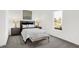 Relaxing bedroom with large windows, a soft bench, and stylish nightstands and lamps at 3548 Planck Cir, Danville, IN 46122