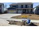Two-story blue home featuring a two car garage, covered front porch, and available signage at 3548 Planck Cir, Danville, IN 46122