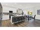 Well-lit kitchen featuring a large island with bar stools, modern appliances, and an open-concept layout at 3548 Planck Cir, Danville, IN 46122