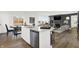 Bright, open kitchen with an island, stainless steel appliances, and views to dining and living areas at 3548 Planck Cir, Danville, IN 46122