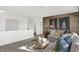 Bright loft area featuring a comfortable sofa, modern art, and a chic glass-top coffee table at 3548 Planck Cir, Danville, IN 46122