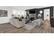 Inviting living room features a fireplace, modern decor, plush seating, and ample natural light from large windows at 3548 Planck Cir, Danville, IN 46122