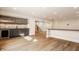 A finished basement features a bar area with wood floors, dark cabinets, and a wine fridge at 3787 Cherwell Dr, Zionsville, IN 46077