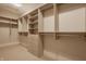This walk-in closet offers ample storage space, with custom shelves, drawers, and rods for all your organizational needs at 3787 Cherwell Dr, Zionsville, IN 46077