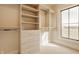 This walk-in closet is fully outfitted with shelves, drawers, and rods for optimal storage and organization at 3787 Cherwell Dr, Zionsville, IN 46077
