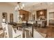 Charming dining area features a wooden table, upholstered chairs, and modern lighting at 3787 Cherwell Dr, Zionsville, IN 46077