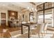 Elegant dining area with a wood table, soft chairs, and bright windows at 3787 Cherwell Dr, Zionsville, IN 46077
