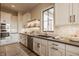 Bright, white kitchen featuring stainless steel appliances, tile backsplash, and hardwood flooring at 3787 Cherwell Dr, Zionsville, IN 46077