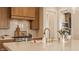 Spacious kitchen with stainless steel stove, custom cabinetry, and marble countertops at 3787 Cherwell Dr, Zionsville, IN 46077