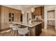 Bright, eat-in kitchen island features stylish stools, ample storage, and modern lighting at 3787 Cherwell Dr, Zionsville, IN 46077