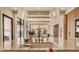 Modern kitchen with stainless steel sink, hardwood flooring, and an open living space at 3787 Cherwell Dr, Zionsville, IN 46077