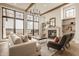 Beautiful living room with a fireplace, hardwood floors, and large windows at 3787 Cherwell Dr, Zionsville, IN 46077