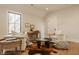 Upstairs living area with hardwood floors, seating, and a desk at 3787 Cherwell Dr, Zionsville, IN 46077