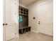 Mudroom with bench seating, cubbies, and tiled flooring at 3787 Cherwell Dr, Zionsville, IN 46077