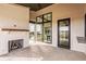 Covered patio featuring an indoor-outdoor fireplace and exterior windows and doors at 3787 Cherwell Dr, Zionsville, IN 46077