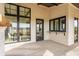 View of the house's covered porch featuring a serving window and view of the surrounding landscape at 3787 Cherwell Dr, Zionsville, IN 46077