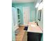 View of a bathroom with walk-in shower, a vanity with marble countertops, and a wall mirror at 424 S Parker Ave, Indianapolis, IN 46201