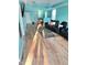 This spacious living room offers wood floors, modern lighting, and comfortable seating, with modern decor at 424 S Parker Ave, Indianapolis, IN 46201