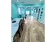 Open-concept design featuring the living and dining area, wood floors, modern lighting, and modern decor at 424 S Parker Ave, Indianapolis, IN 46201