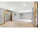 This large finished basement has neutral carpet and trim, and an adjoining staircase to the upper level at 4590 Turkey Track Rd, Martinsville, IN 46151