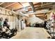 Unfinished basement features exposed pipes, mechanicals, and shelving for storage, with concrete floor at 4590 Turkey Track Rd, Martinsville, IN 46151