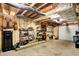 Unfinished basement with exposed ductwork and utility lines, and storage shelves along the walls at 4590 Turkey Track Rd, Martinsville, IN 46151
