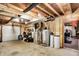 Unfinished basement space with exposed ductwork and mechanicals, including a water heater and furnace at 4590 Turkey Track Rd, Martinsville, IN 46151