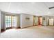 This finished basement has a large living area with an exit to the backyard and doors to other rooms at 4590 Turkey Track Rd, Martinsville, IN 46151