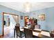 Dining room with chandelier, wood floors, and access to other living spaces at 4590 Turkey Track Rd, Martinsville, IN 46151