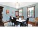 Dining room features stylish chandelier, neutral walls, and large windows for natural light at 4590 Turkey Track Rd, Martinsville, IN 46151