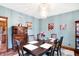 Formal dining room features a modern chandelier, hardwood floors, and a decorative cabinet at 4590 Turkey Track Rd, Martinsville, IN 46151